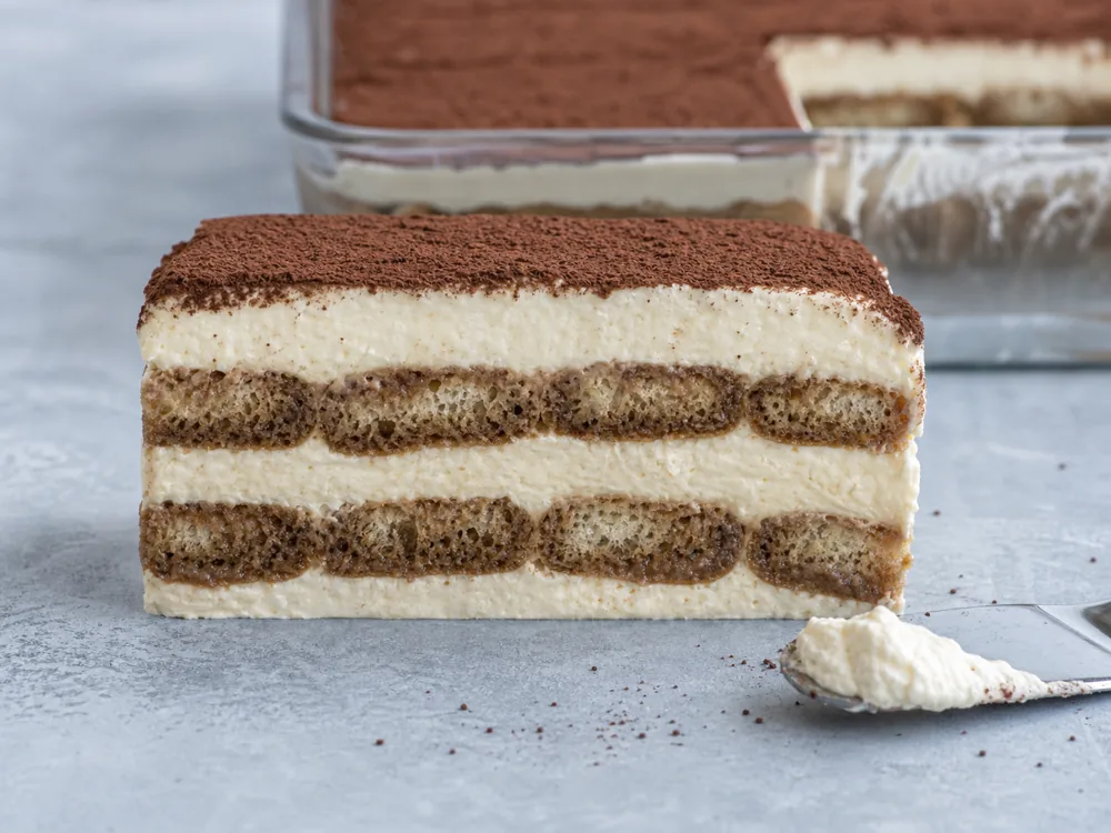 Chilled tiramisu slice with distinct soaked cake and stable mascarpone layers - Mascarpone | KnowTheCheese