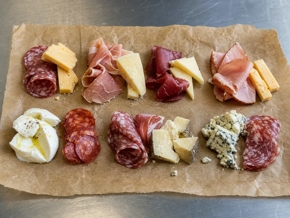 Meat and cheese bites grouped by cured, smoked, and salty styles - cheese and meat pairing | KnowTheCheese