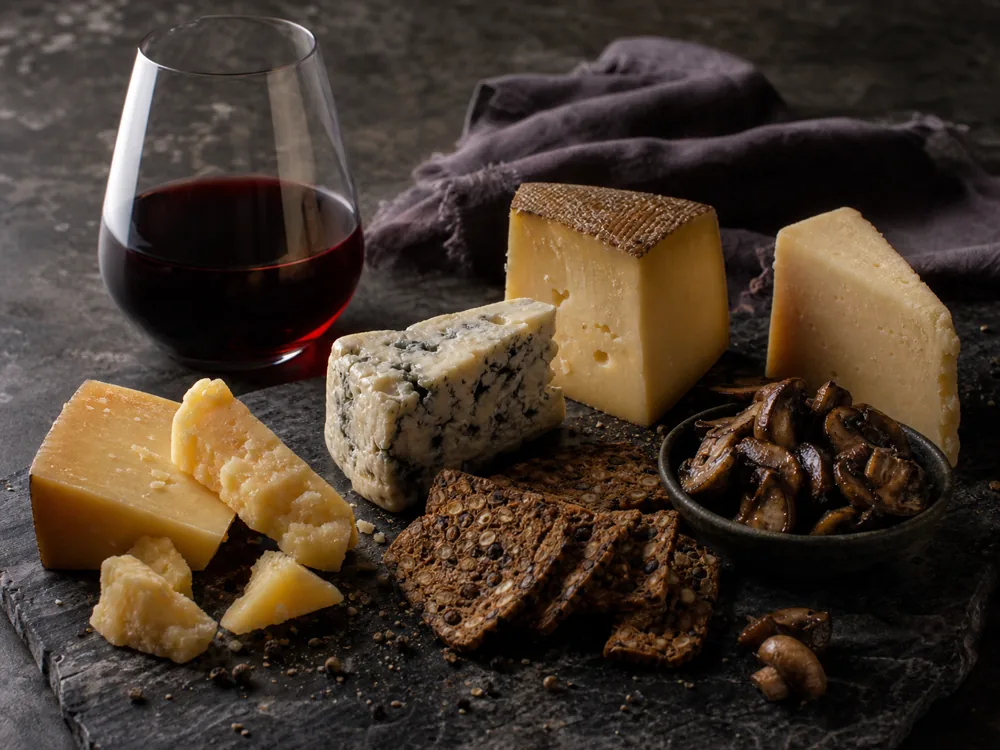 Syrah-style red wine with aged gouda, blue cheese, sheep cheese, and savory crackers - Syrah cheese pairing | KnowTheCheese
