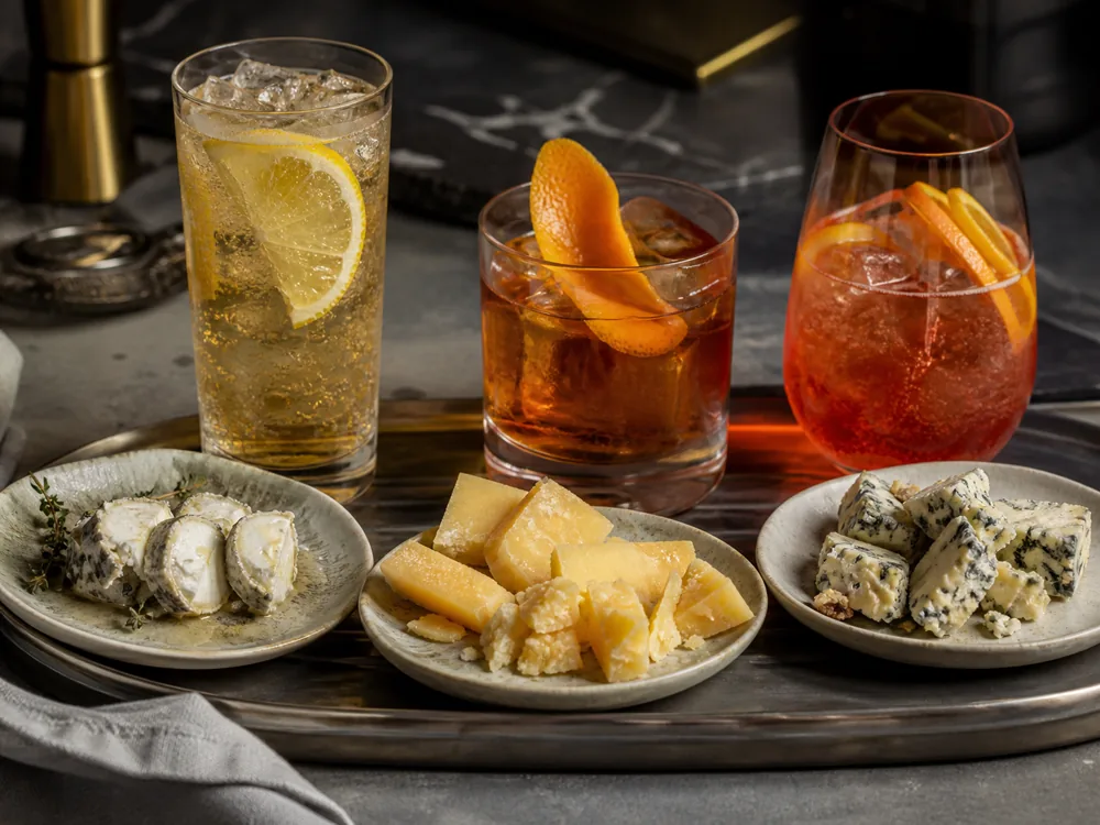 Citrus, stirred, and spritz cocktails matched with cheese bites - cocktail cheese pairing | KnowTheCheese