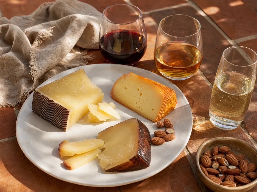 Spanish-style cheeses paired with red wine, sherry, and cava pours - Spanish cheese and wine pairing | KnowTheCheese