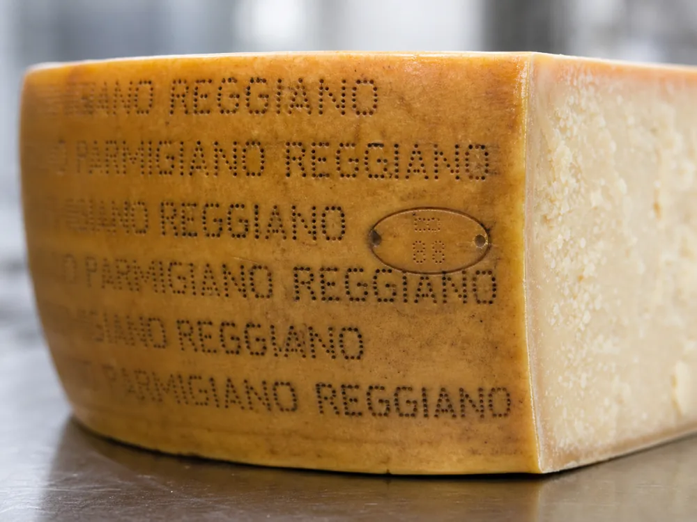 Parmigiano-Reggiano pin-dotted rind marking and casein plaque - Parmigiano-Reggiano | KnowTheCheese