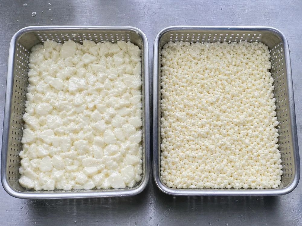 Larger fresh-style curds beside smaller aged-style curds for Pecorino Toscano - Pecorino Toscano | KnowTheCheese