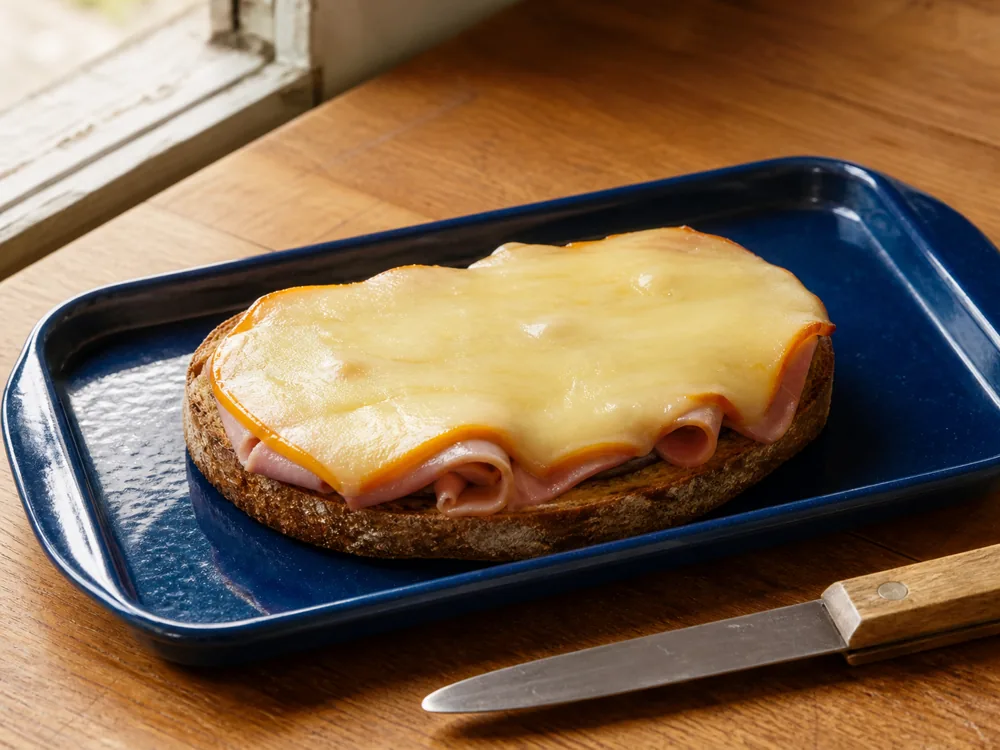 Port Salut melted on an open grilled ham tartine - Port Salut | KnowTheCheese