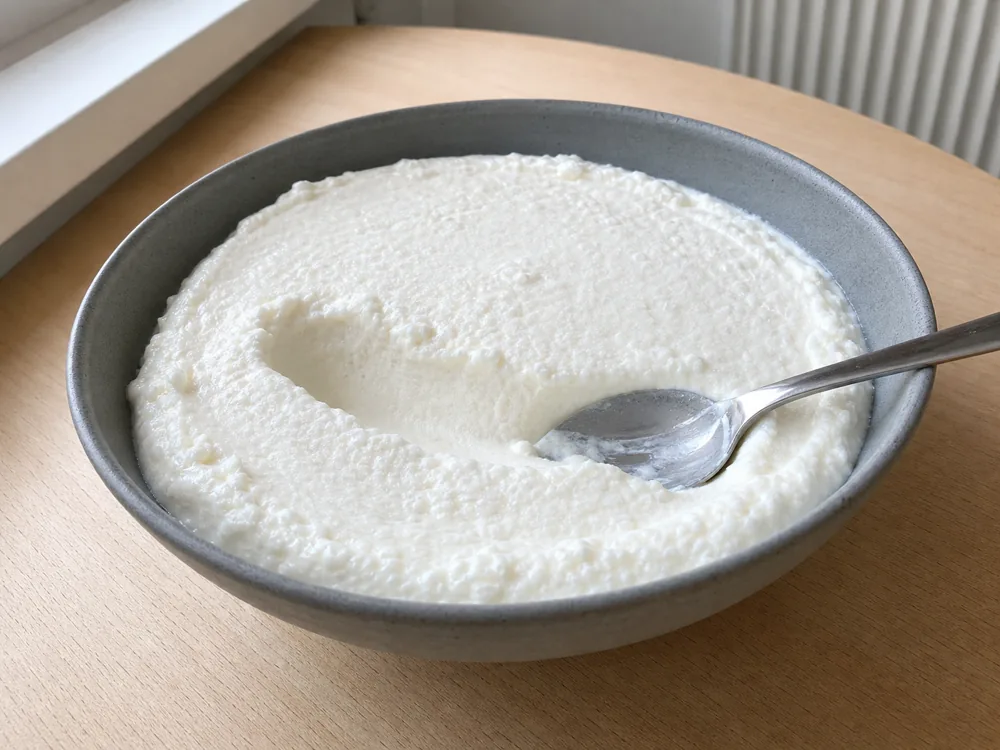 Plain German quark showing its thick fine-curd texture - Quark | KnowTheCheese