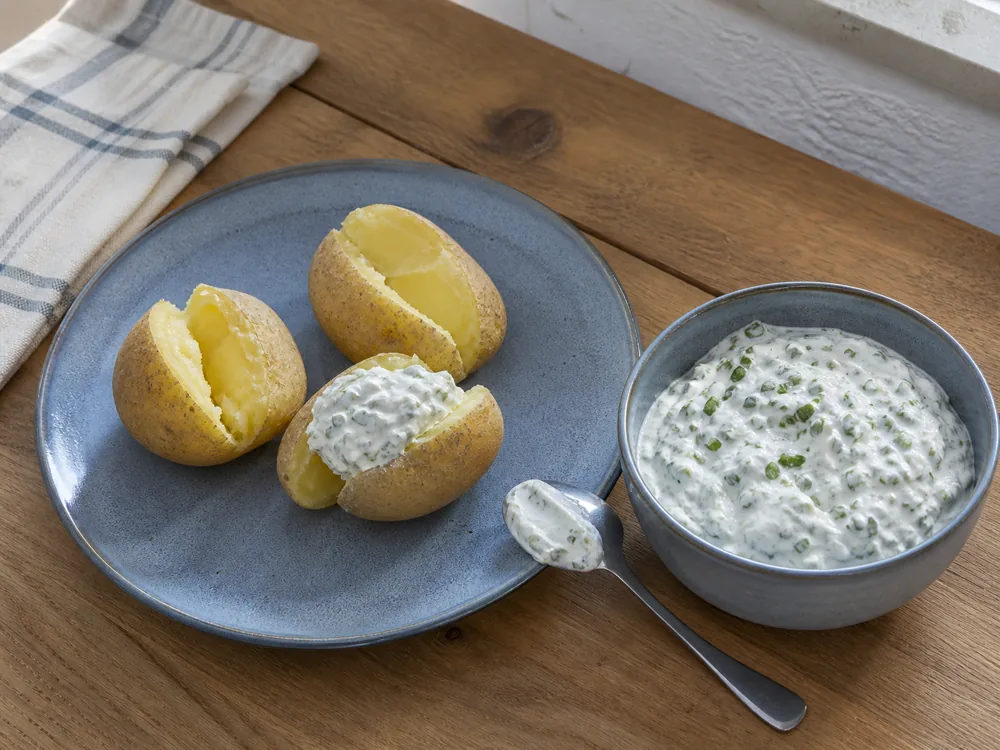 Boiled potatoes served with herb quark - Quark | KnowTheCheese