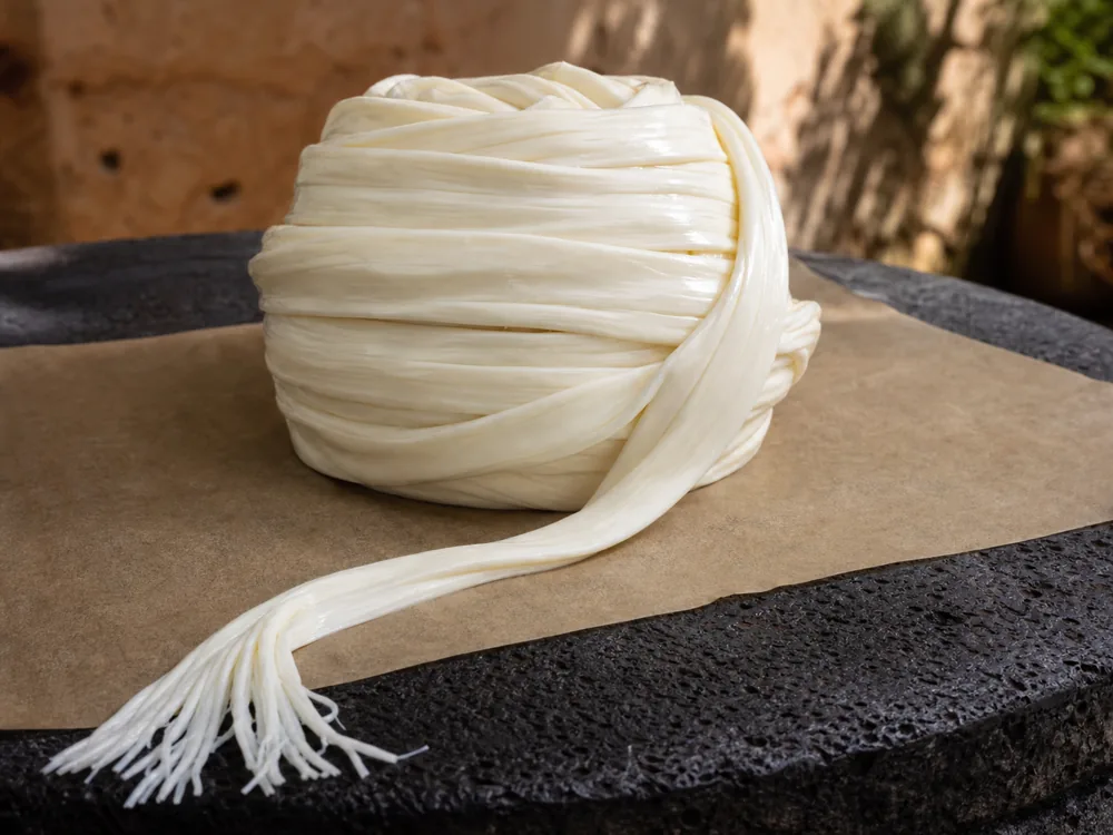 Quesillo wound from a broad cheese ribbon with fine fibers - Quesillo | KnowTheCheese