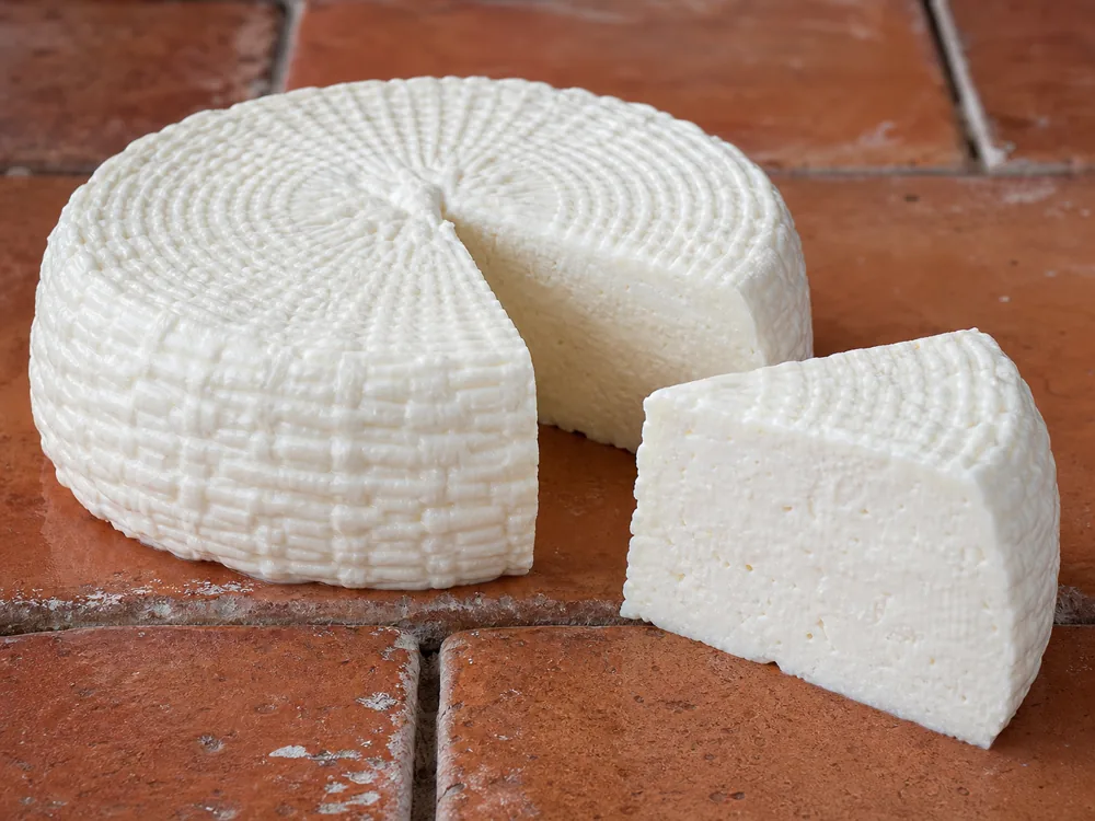 Basket-ridged Queso Panela wheel cut open - Queso Panela | KnowTheCheese