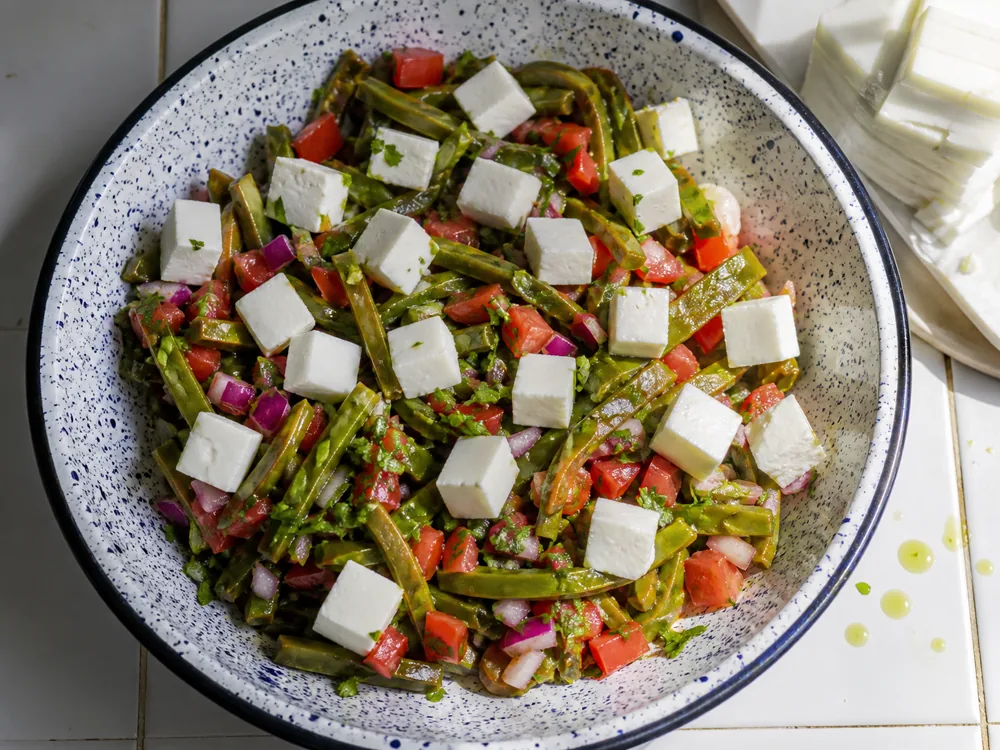 Cubed queso panela holding its shape in a chilled nopales and tomato salad - Queso Panela | KnowTheCheese