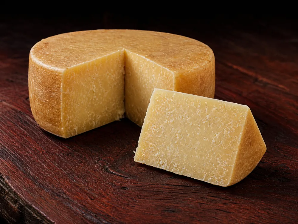 Reggianito dry granular break and grated texture - Reggianito cheese | KnowTheCheese