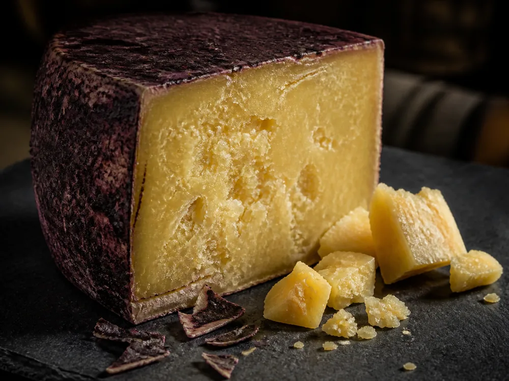Dark red wine rind and crumbly yellow Swiss hard cheese paste - Rotwein Bargler Extra Wurzig | KnowTheCheese