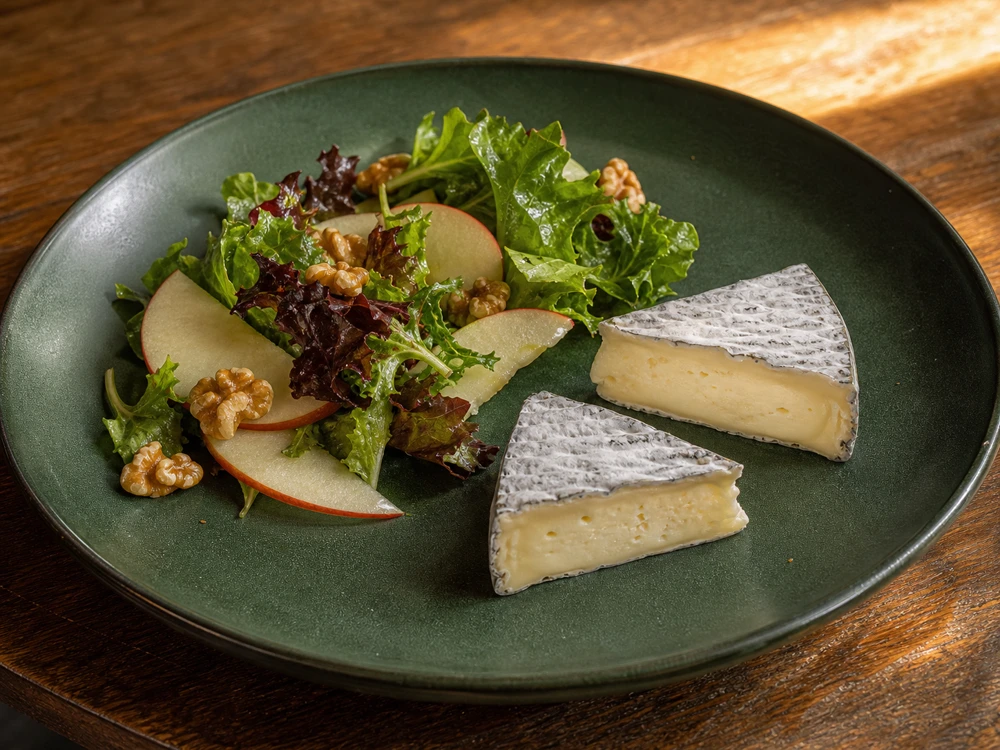 Warmed Selles-sur-Cher wedges served with bitter leaves apple and walnuts - Selles-sur-Cher cheese | KnowTheCheese