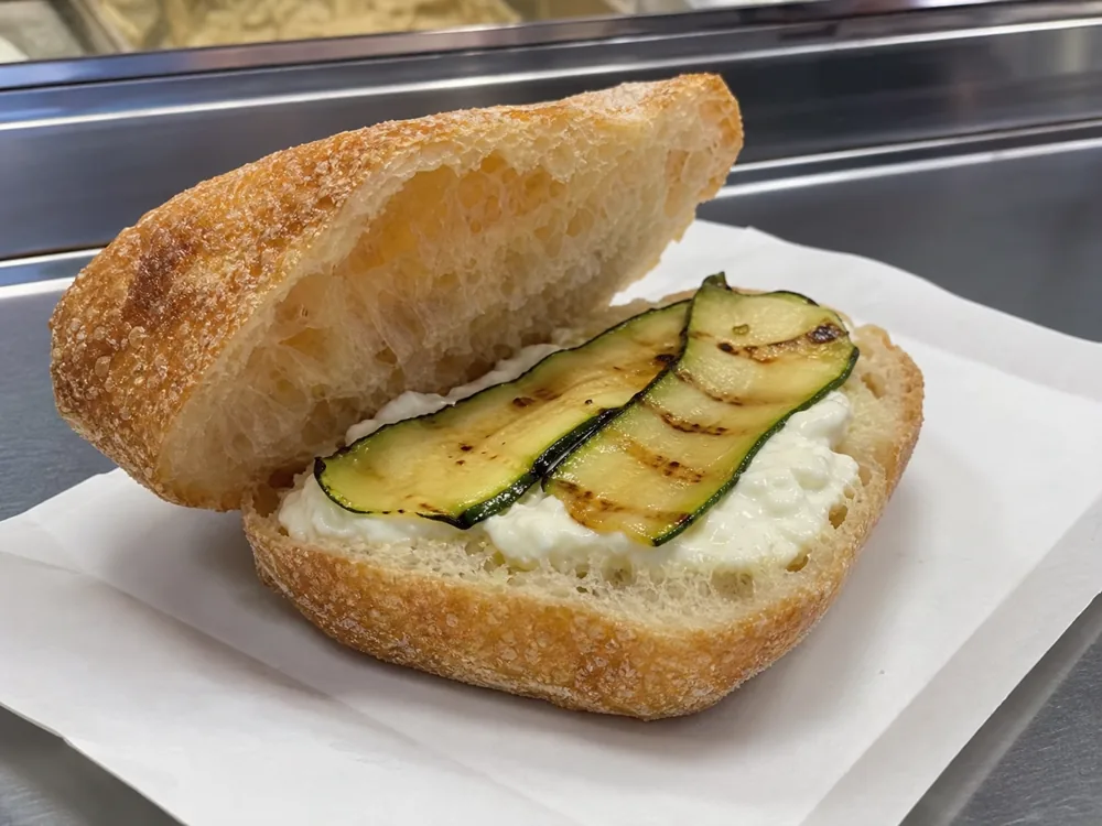 Warm ciabatta with a thin layer of Stracchino and roasted zucchini - Stracchino | KnowTheCheese