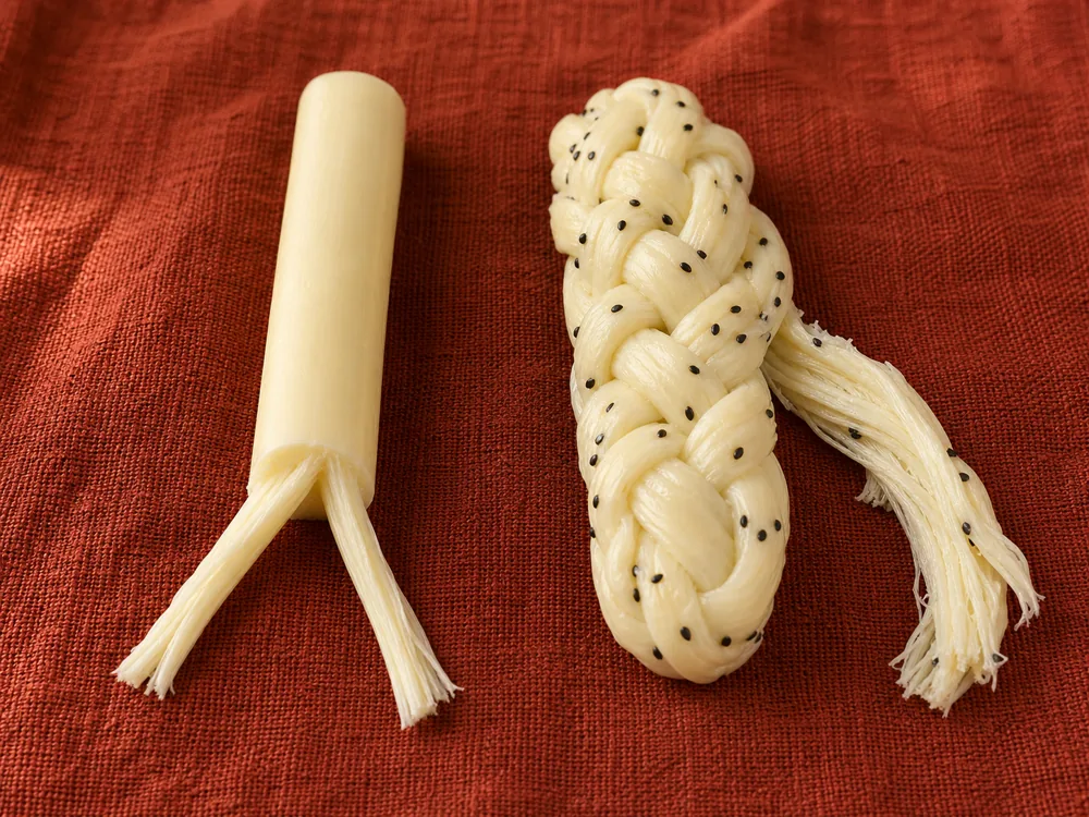 American snack stick beside Armenian braided string cheese - String Cheese | KnowTheCheese