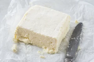 Square of ripe Teleme with soft slumping ivory paste - Teleme cheese | KnowTheCheese