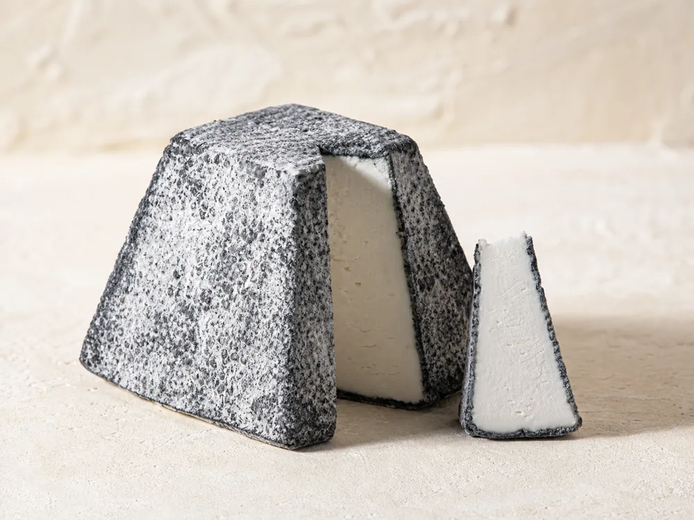 Valencay truncated pyramid cut open to show its ash rind and white paste - Valencay | KnowTheCheese