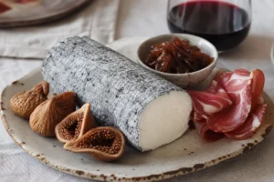 Ash coated matured goat cheese log with figs balsamic onions cured meat and wine - Yarra Valley Vintage Savourine | KnowTheCheese
