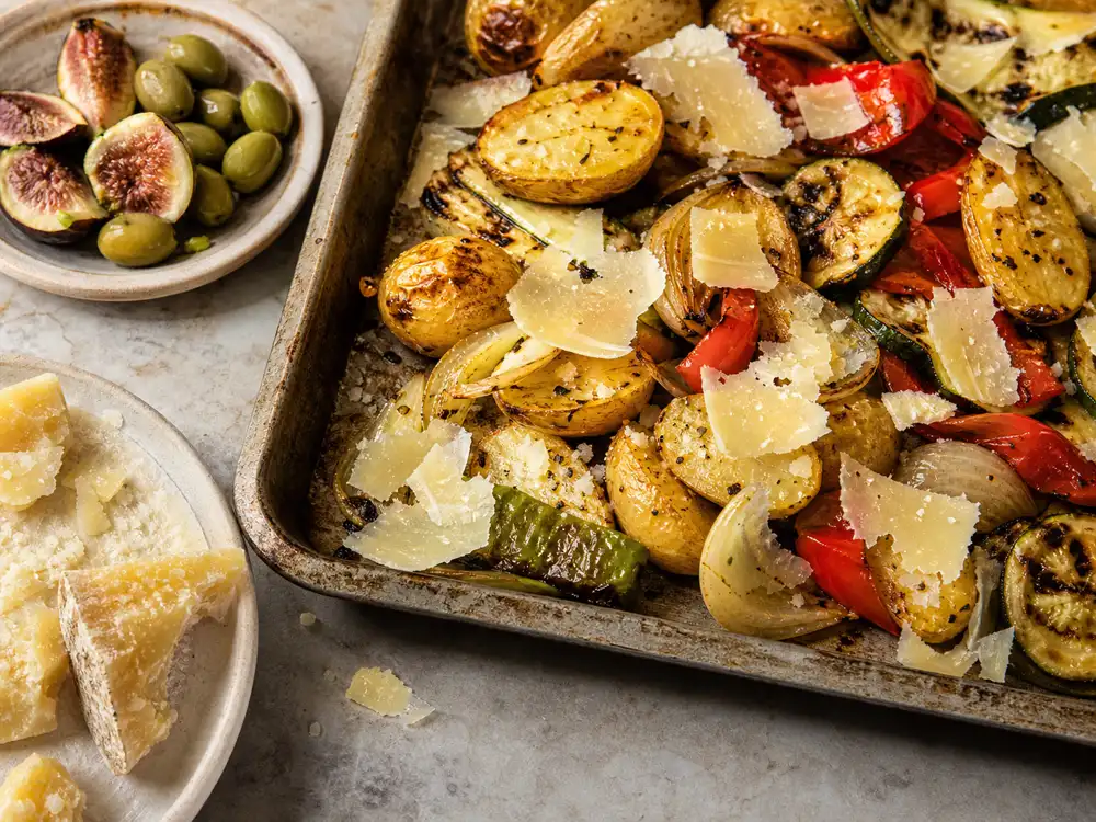 Croatian extra mature hard cheese shavings over roasted potatoes and vegetables - Zigljen Iz Extra Mature | KnowTheCheese